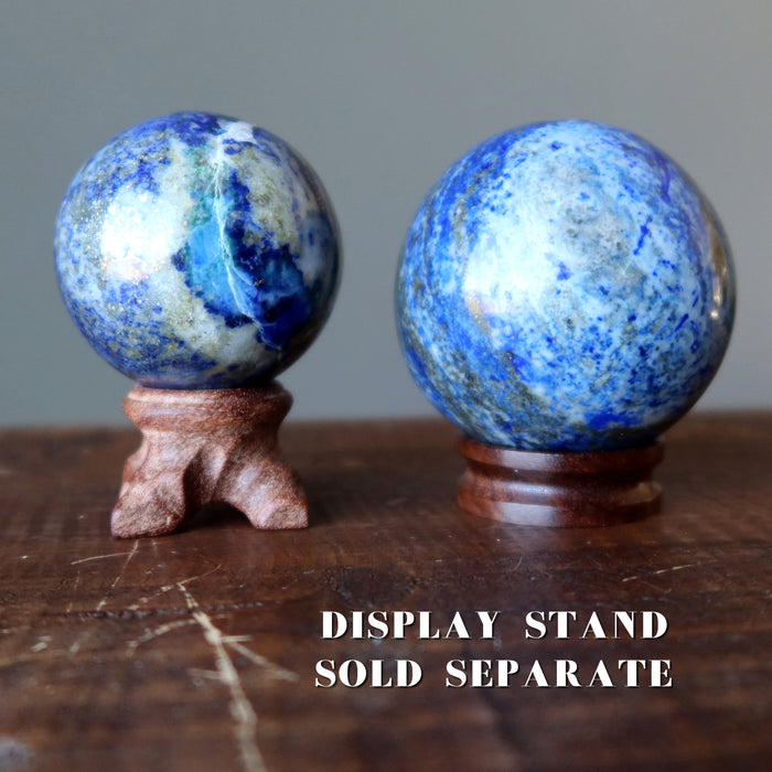 two denim lapis sphere on display stands