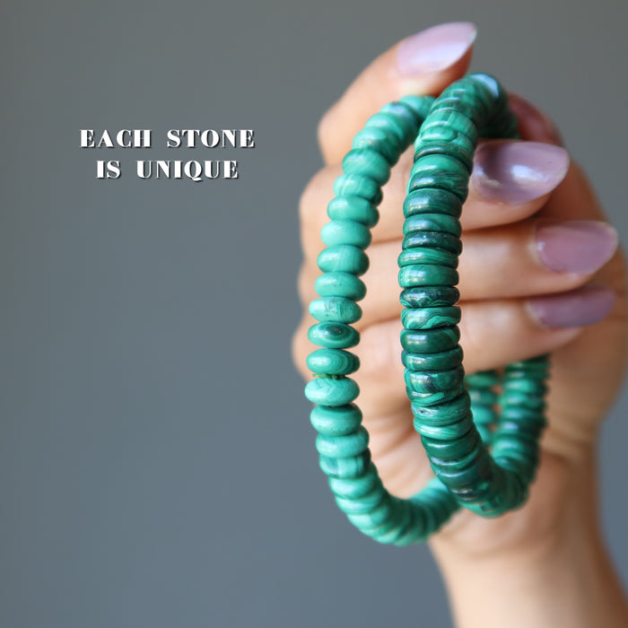 hand holding two malachite bracelets