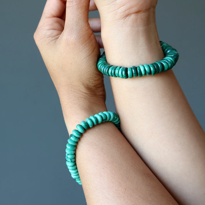 malachite bracelets on wrists