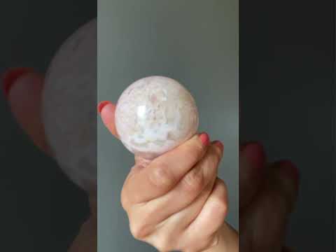 video on pink rhodonite sphere
