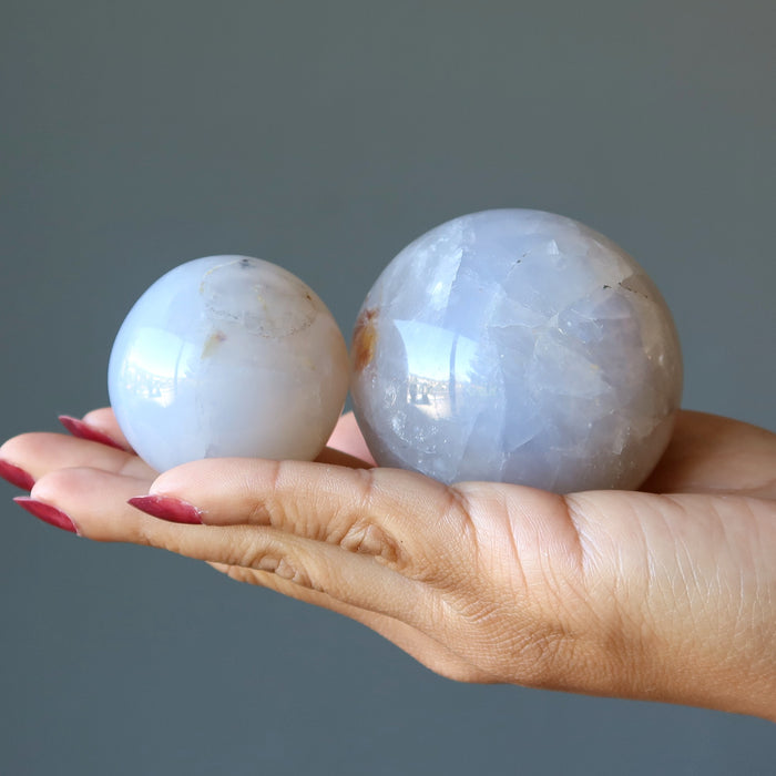 blue quartz spheres in hand