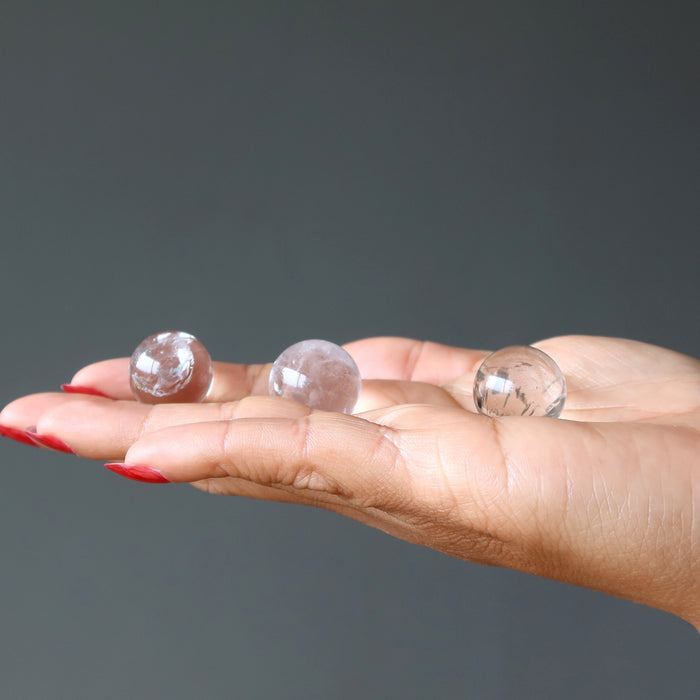 clear quartz spheres in hand