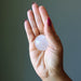 included quartz sphere in palm