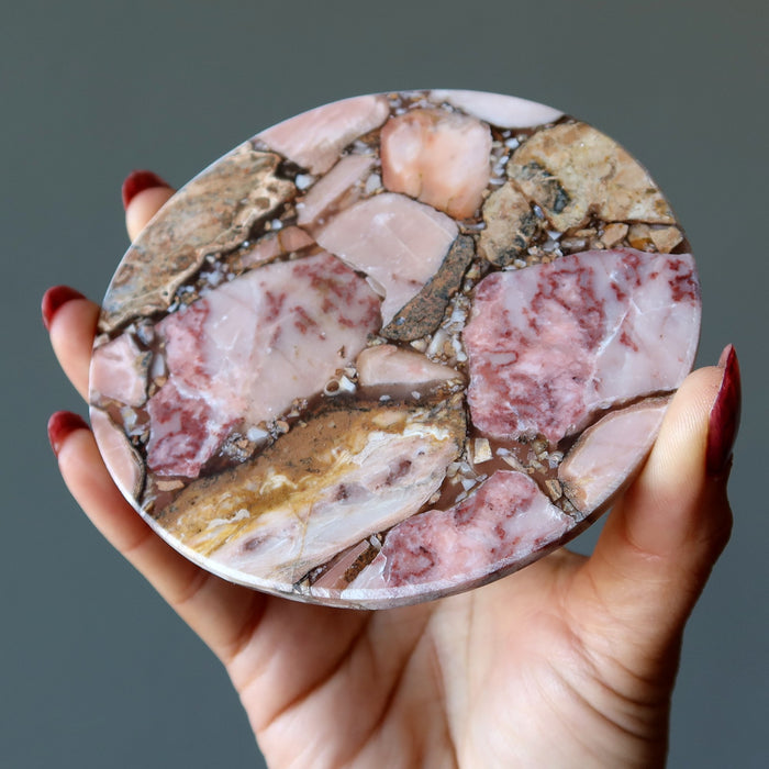 holding Rhodonite Charger 