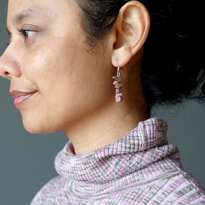 woman wearing rhodonite earrings