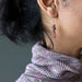 rhodonite earrings on ear