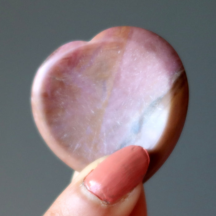 Holding Pink Rhodonite Worry Stone 
