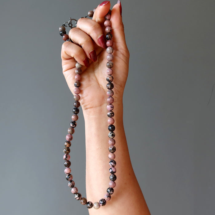 beaded rhodonite necklace in hand
