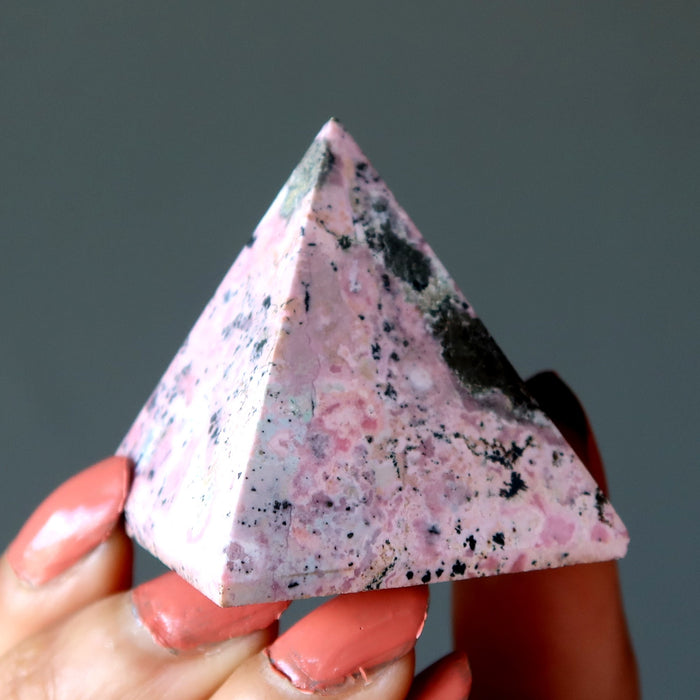 pink and black rhodonite pyramid