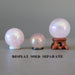 three aura rose quartz crystal balls on stands
