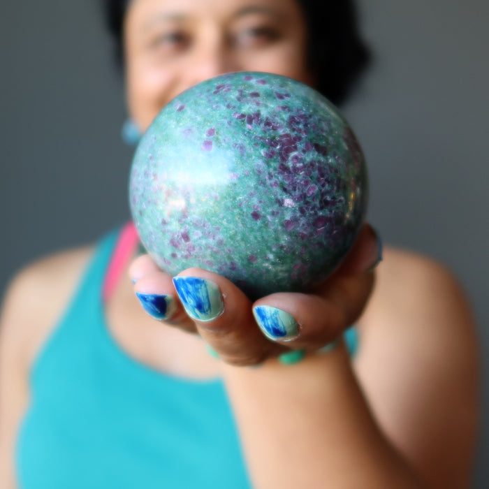 ruby kyanite sphere in hand