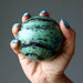 ruby zoisite sphere in hand