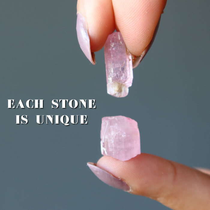 two rough pink tourmaline gemstones