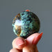 african turquoise sphere in hand