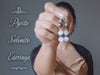 video featuring pyrite selenite earrings