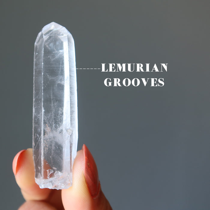 lemurian quartz point crystal with grooves