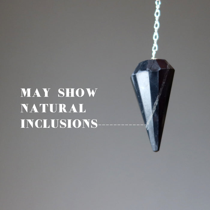 shungite pendulum showing natural inclusions