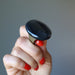 hand holding large oval black agate ring