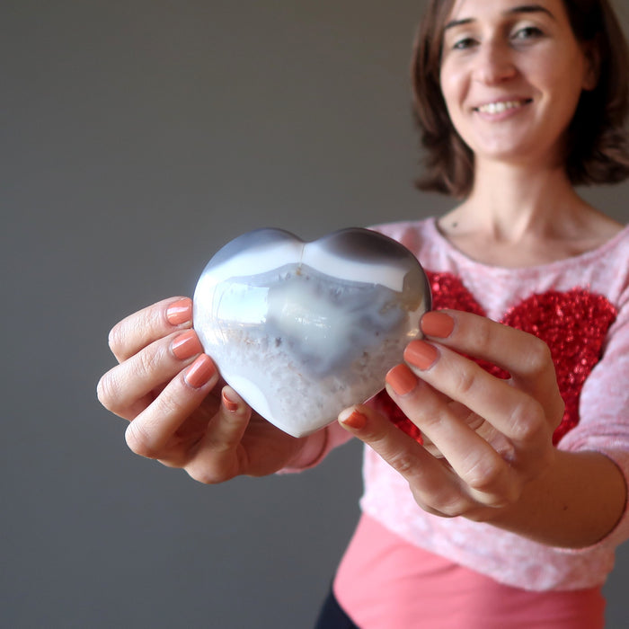 female model holding Blue Lace Agate Heart