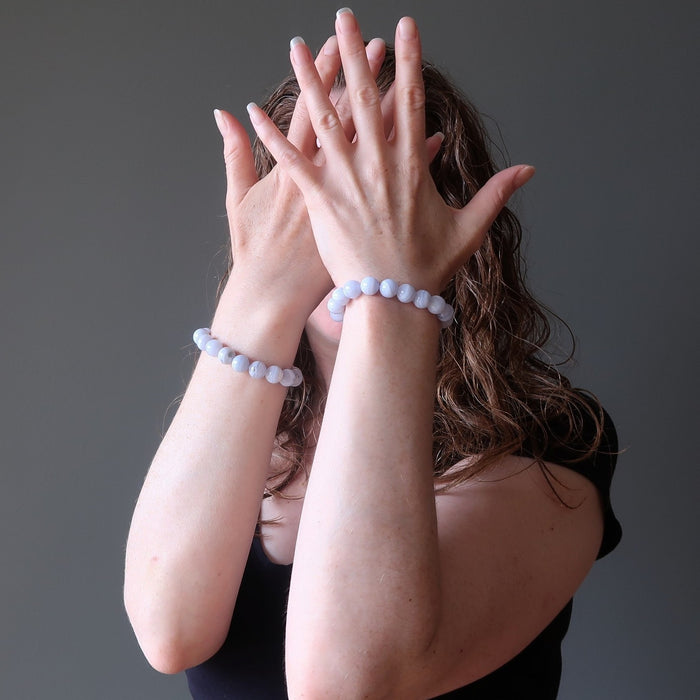 jamie of satin crystals wearing blue lace agate round beaded stretch bracelets
