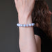 jamie of satin crystals wearing blue lace agate round beaded stretch bracelets