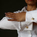 yellow crazy lace agate cufflinks modeled by a lady in french cuff shirt