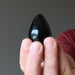 hand holding black agate egg