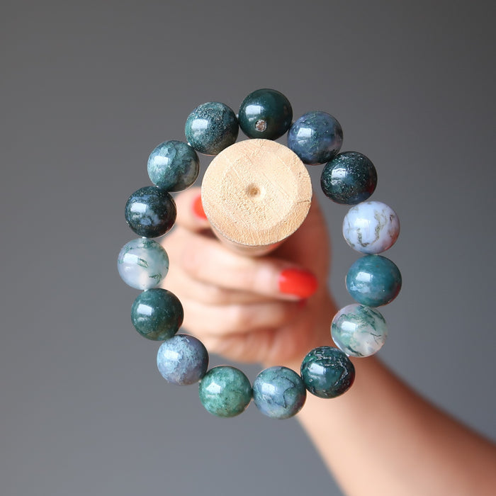 green and white moss agate round beaded stretch bracelet on a stick