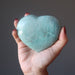 model hand holding light green Amazonite Heart Shiny Stone