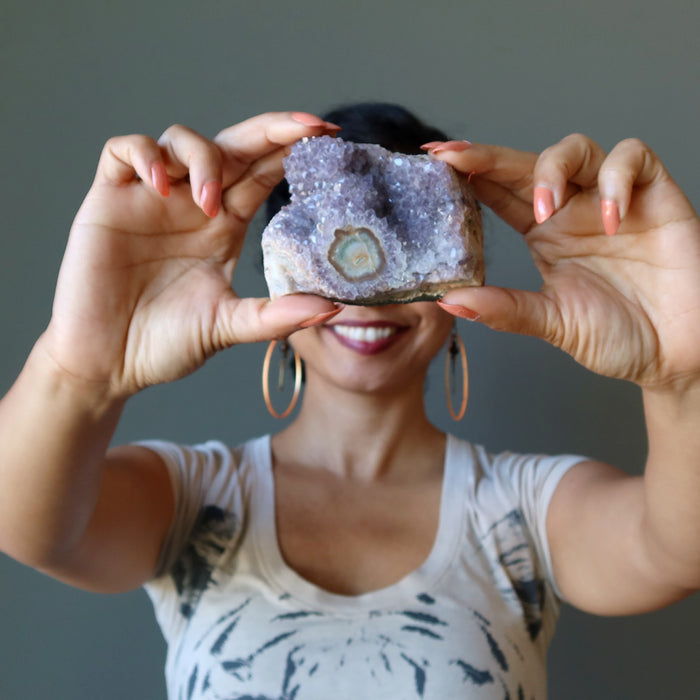 sheila of satin crystals holding amethyst cluster geode