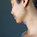 female model wearing raw amethyst hoop earrings