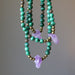 displaying three sizes of The necklaces made of raw purple Amethyst point  and banded green Malachite round beads accented with metal beads and secured with a large lobster clasp