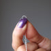 showing the sterling silver twist ring at the end of of the pendulum