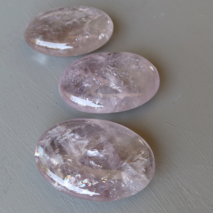 3 translucent purple oval polished palm stones