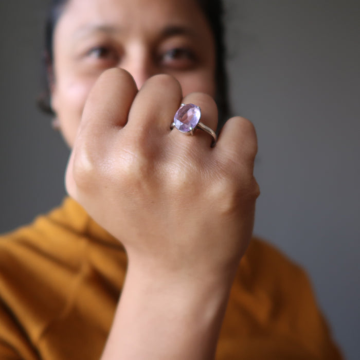 sheila of satin crystals wearing a faceted oval amethyst gemstone in silver ring