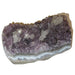 laying down displaying 3.8"X2.5"X2" purple Amethyst with calcite cluster 