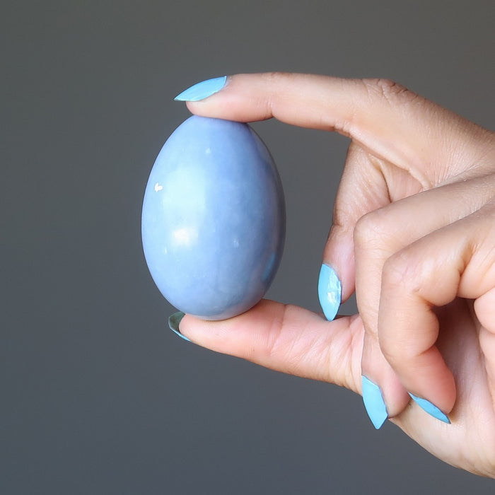 hand holding angelite egg