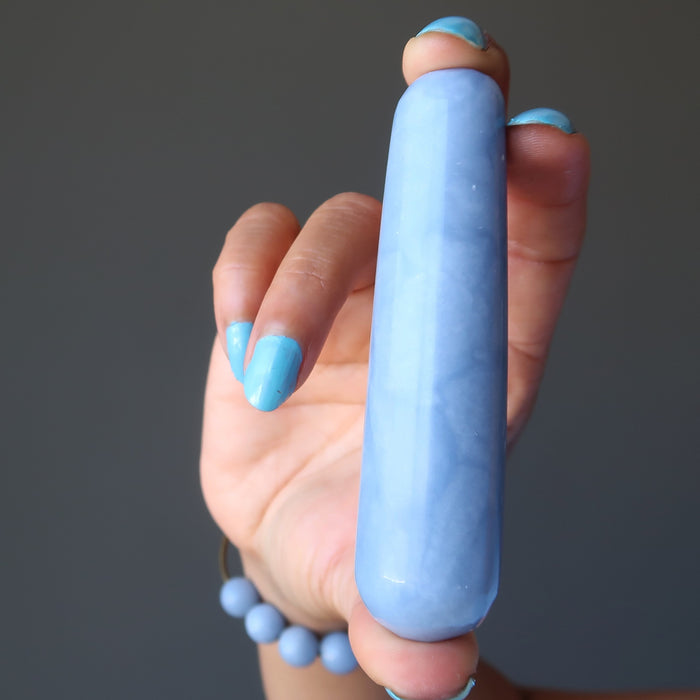 hand holding blue angelite tapered massage wand