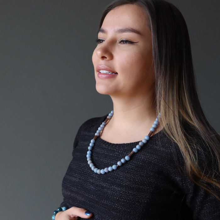 woman wearing a beaded angelite necklace