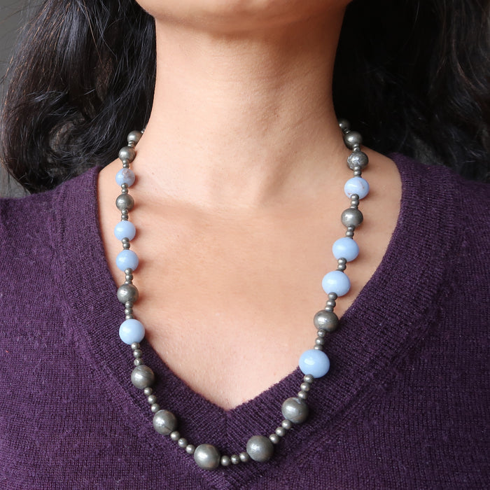 pyrite and angelite beaded necklace on woman's neck