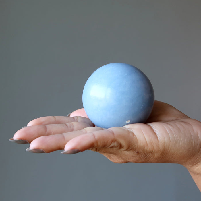 angelite sphere in palm of hand