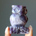 fingers holding 2.25-2.5 Inch purple Amethyst owl