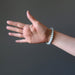 female hand modeling aquamarine bracelet