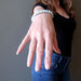 female hand modeling aquamarine bracelet+