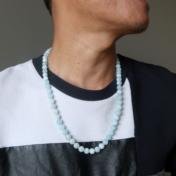 male wearing blue aquamarine necklace