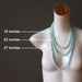 three blue aquamarine necklaces on mannequin to show length difference