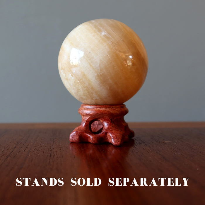 brown aragonite sphere on fancy wood display stand