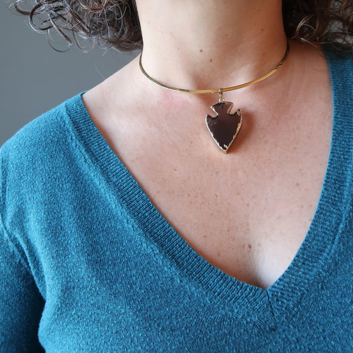 smoky quartz arrowhead necklace on female neck