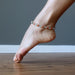 barefoot wearing multi colored aventurine anklet