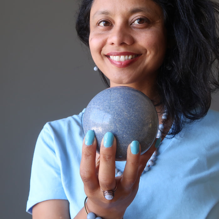 sheila of satin crystals holding blue aventurine sphere